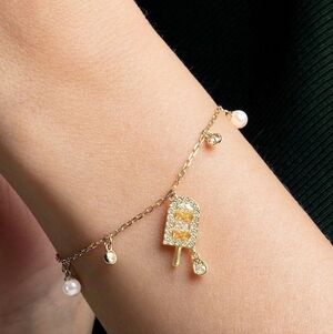 Swarovski No Regrets Gold Toned Popsicle Charm Bracelet- Good Condition